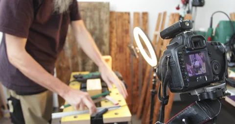 Vlogging, DIY woodworking, drawing cutting lines on wood block, filming Stock Footage 154823739