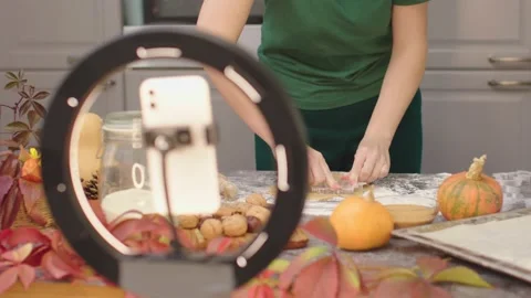 Vlogging in kitchen cooking pastry fall maple leaf shape cookies biscuits video Video stock 219434343
