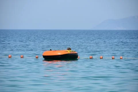 Vlora albania august a boy in a colorful inflated trendy floating blue sea Stock Photos