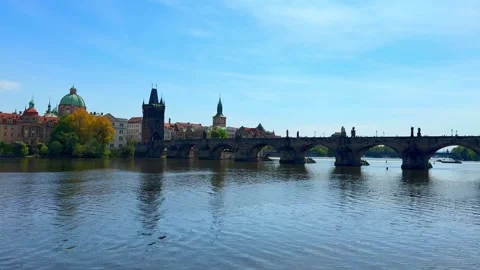 Vltava river and the Charles Bridge in Prague on a sunny day Stock Footage 336183192