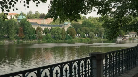 The Vltava River flows near a scenic promenade in historic Prague, Czechia. Video stock 341971271