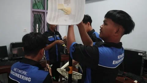 Vocational high school students practice configuring a Wi-Fi network Stock-Footage 341835148