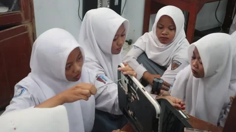 Vocational high school students practicing laptop repair. Stock Footage 348295420