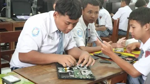 Vocational high school students practicing laptop repair. Stock Footage 348295428