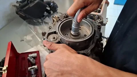 Vocational Students Assembling Motorcycle Engine Components Stock Footage 319058979