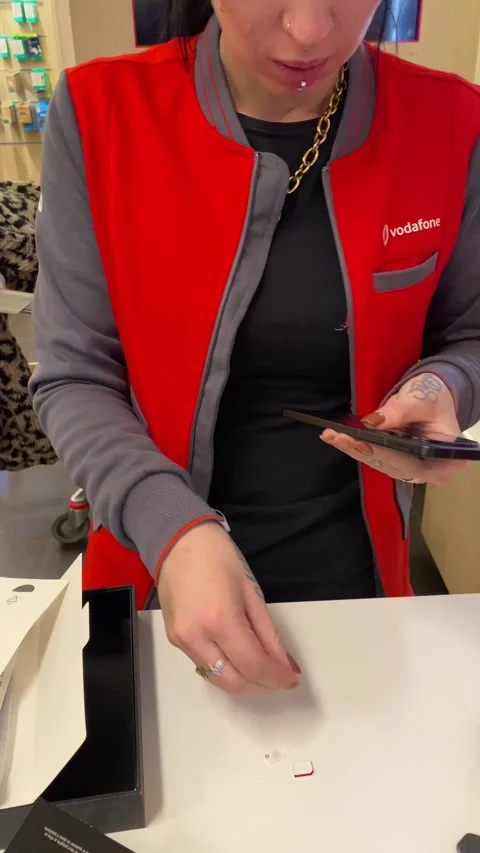 Vodafone employee unboxing and setting up new nokia smartphone Video stock 302758835