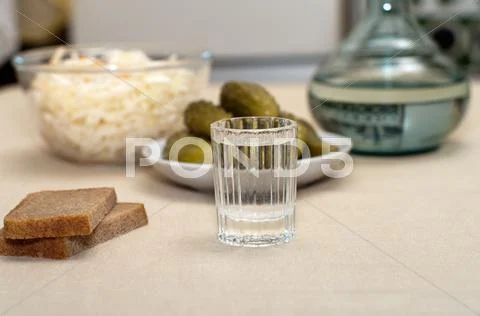 Vodka and snack. Stock Photos
