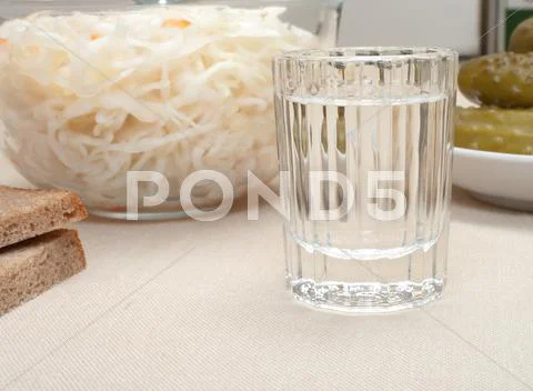 Vodka and snack. Stock Photos