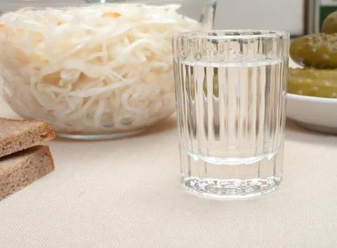 Vodka and snack. Stock Photos
