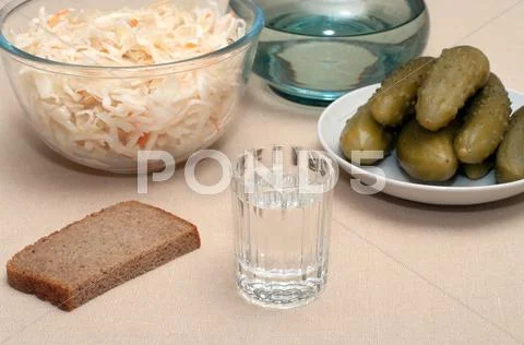 Vodka and snack. Stock Photos