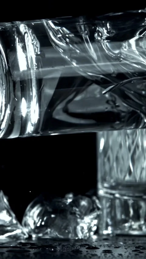 Vodka in a glass falls on the table. Filmed on a high-speed camera at 1000 fps Stock Footage 335366152