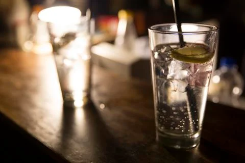 Vodka lemon with ice cubes Stock Photos