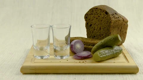 Vodka is poured into a glass. Stock Footage 98444662