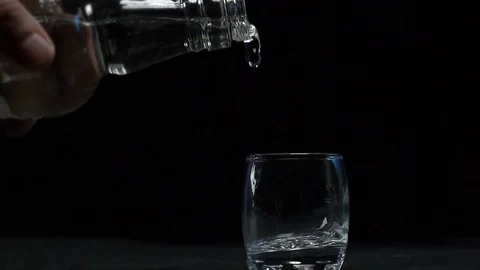 Vodka is poured into a stack Stock Footage 119282988