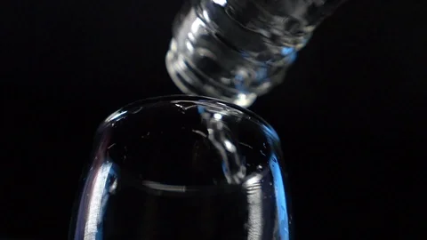 Vodka is poured into a stack Stock Footage 119283043