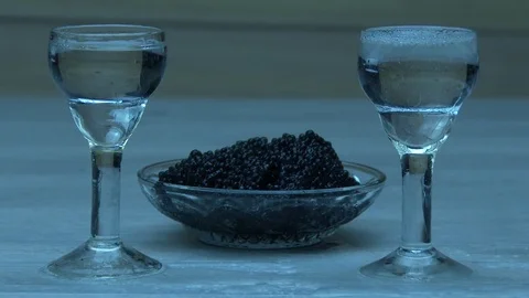 Vodka is pouring into little cups 스톡 동영상 80943468