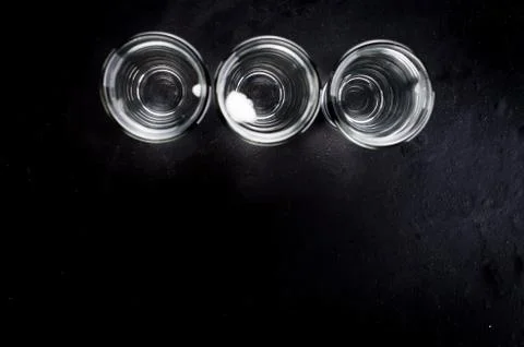 Vodka shots on black table Stock Photos
