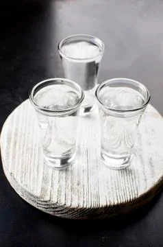 Vodka shots on black table Stock Photos