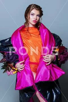 Vogue shot of a female model posing at studio. Fashion collection. Portrait o Stock Photos