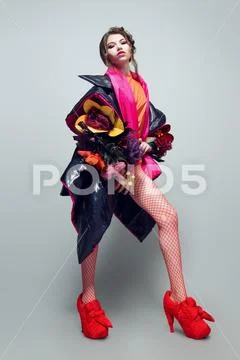 Vogue shot of a female model posing at studio. Fashion collection. Full lengt Stock Photos