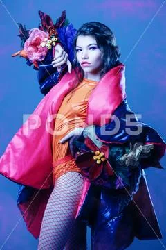 Vogue shot of a female model posing at studio. Fashion collection. Portrait o Stock Photos