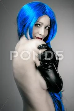Vogue style portrait of beautiful delicate woman with blue hair Stock Photos
