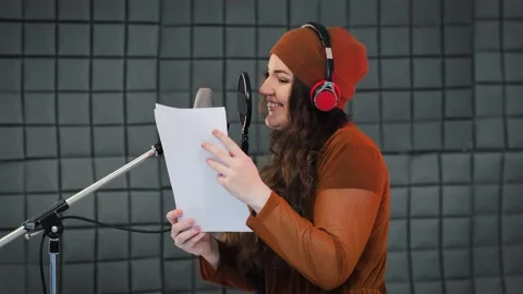 Voice acting of characters, recording in studio, reading text from script Video stock 133429923