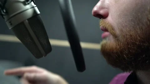 Voice actor performing at recording studio close shot near a microphone Stock Footage 154429933
