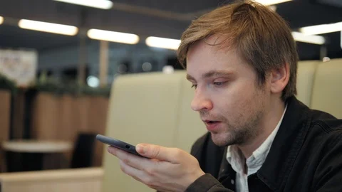 Voice recognition with smart phone speech helper message in cafe Stock Footage 89288109