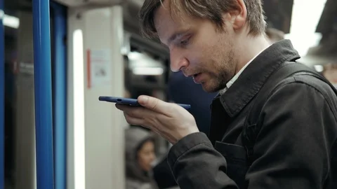 Voice recognition with smart phone speech helper message in train subway Stock Footage 89288434