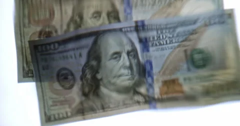 Volatility concept. 100 US Dollar Banknote Distorted Through Wavy Water Surface Stock Footage 341631700
