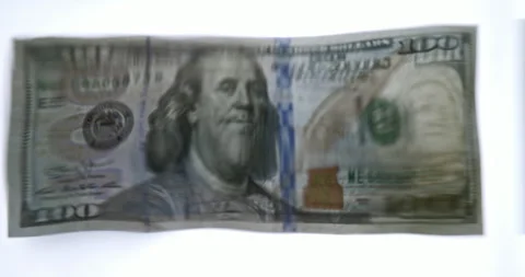 Volatility concept. 100 US Dollar Banknote Distorted Through Wavy Water Surface Stock Footage 341632398
