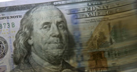 Volatility concept. 100 US Dollar Banknote Distorted Through Wavy Water Surface Stock Footage 341632440