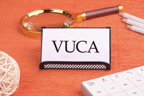 Volatility Uncertainty Complexity Ambiguity. VUCA text on a white business ca Stock Photos