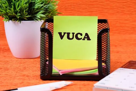 Volatility Uncertainty Complexity Ambiguity. VUCA text on a yellow sticker .. Stock Photos