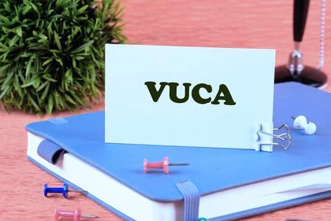 Volatility Uncertainty Complexity Ambiguity. VUCA text on a white business ca Fotos de archivo