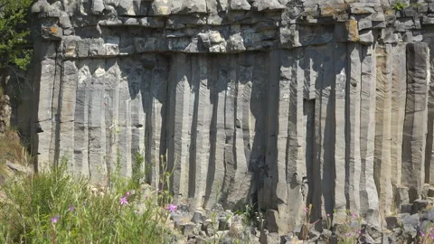 The volcanic basalt columns rock wall of Racos in Romania Stock Footage 261595873
