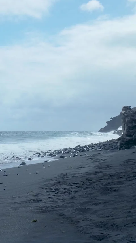 Volcanic black sand beach with ocean waves Stock Footage 329865749