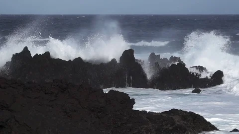 Volcanic coast, waves breaking in super slow motion Stock Footage 83843627