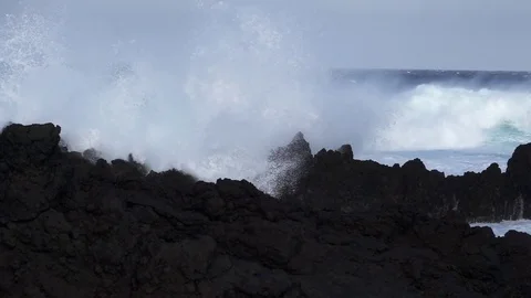 Volcanic coast, waves breaking in super slow motion Stock Footage 83934001