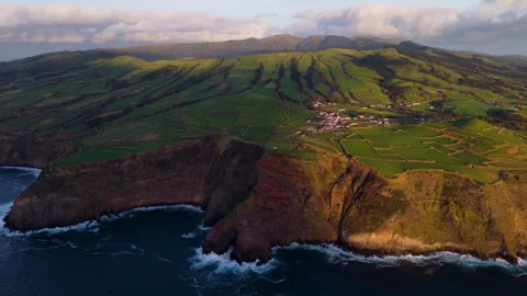 Volcanic Coastal Cliffs and Patchwork Fields at Sunset - São Miguel - Azores - Stock Footage 339780892