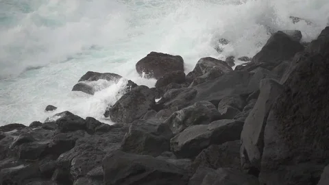 Volcanic coastline and waves breaking, super slow motion Stock Footage 72974367