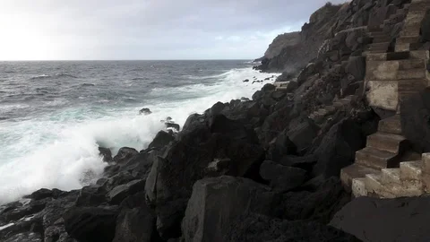 Volcanic coastline and waves breaking, super slow motion Stock Footage 73220385