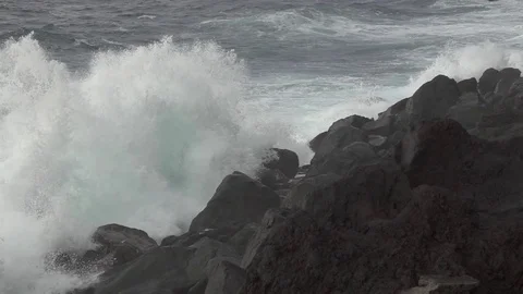 Volcanic coastline and waves breaking, super slow motion Stock Footage 73299744