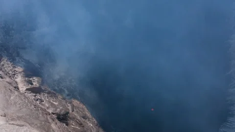 Volcanic crater lake of Mount Michael with toxic smoke Stock Footage 335499190