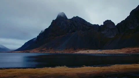 Volcanic dark mountains, with grass, dark moody cloudy scenery, Iceland Stock Footage 260898107