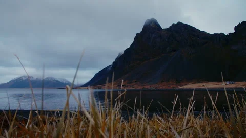 Volcanic dark mountains, with grass, dark moody cloudy scenery, Iceland Stock Footage 260898503