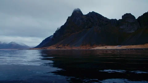 Volcanic dark mountains, with grass, dark moody cloudy scenery, Iceland Stock Footage 260898929