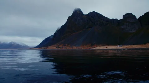 Volcanic dark mountains, with grass, dark moody cloudy scenery, Iceland Stock Footage 260899810