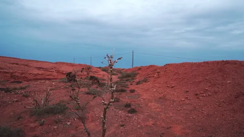Volcanic desert with dark clouds Stock Footage 318791541